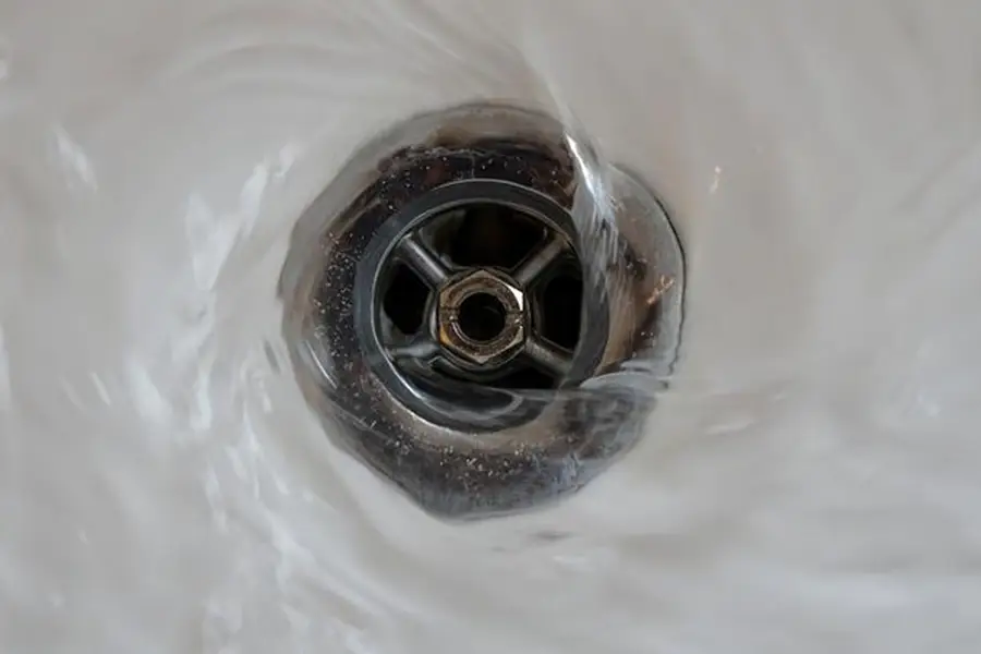 Bathtub drain showing signs of toilet backup
