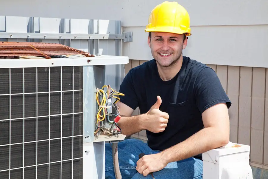 Technician servicing an HVAC unit