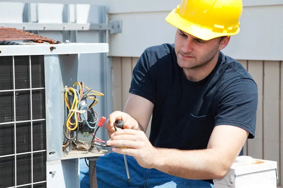 Technician performing hvac maintenance