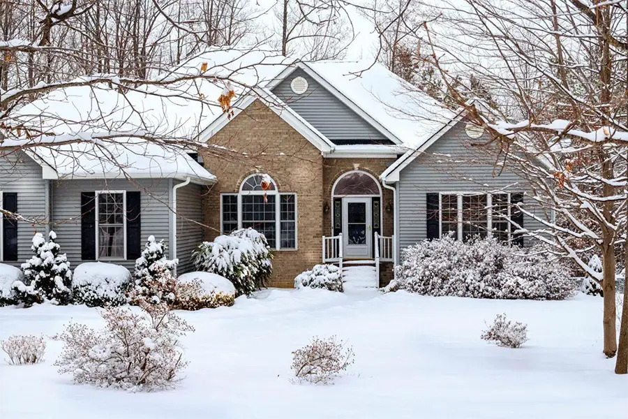 House surrounded by winter snow