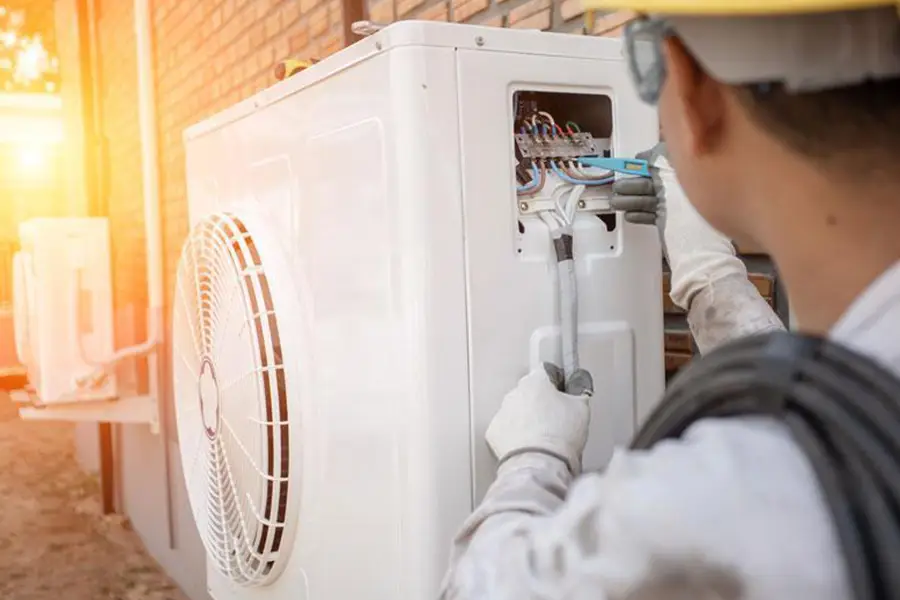 Technician performing AC replacement