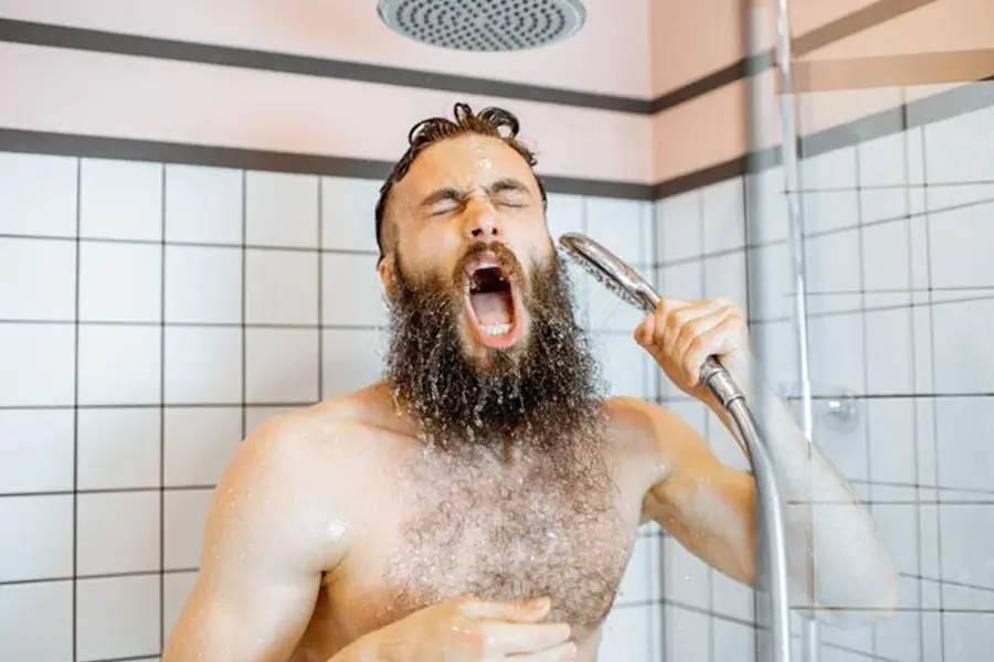 Man showering, needing tankless water heater