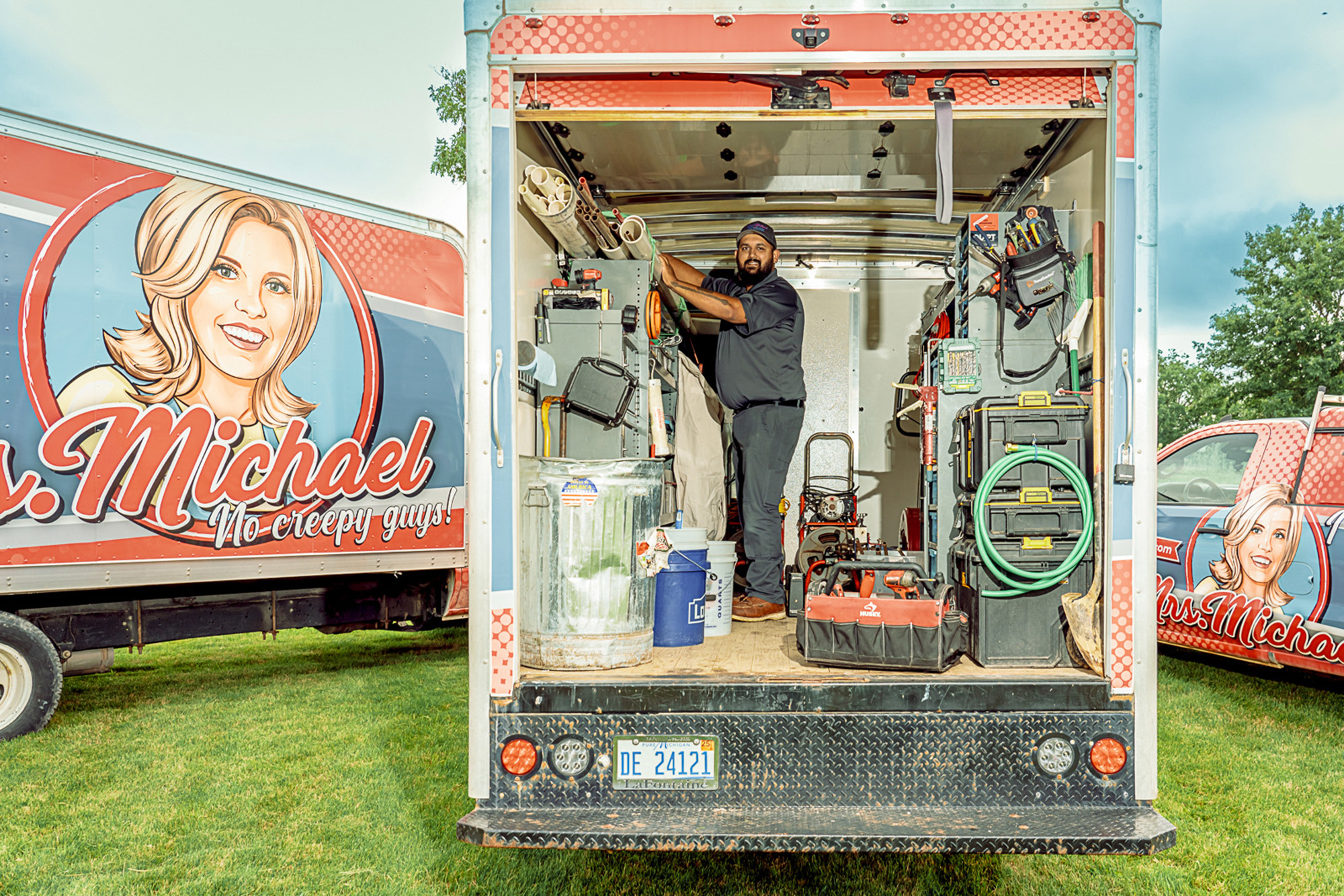 Mrs. Michael home service technician inside a truck
