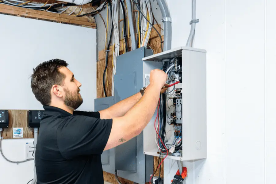 Electrician addressing winter storm power surges