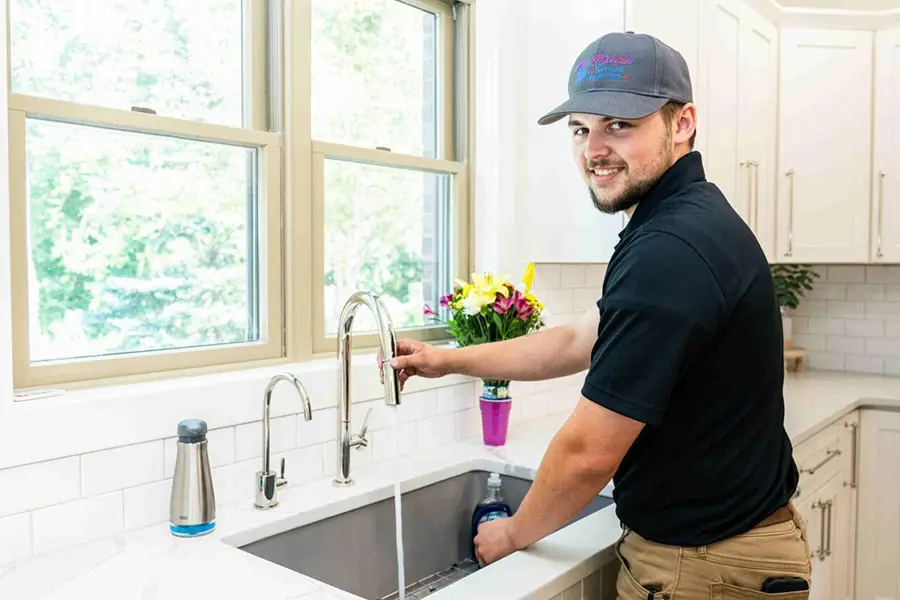 Plumber providing plumbing services