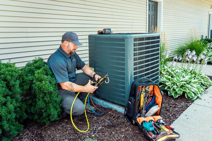 Technician performing AC replacemnt
